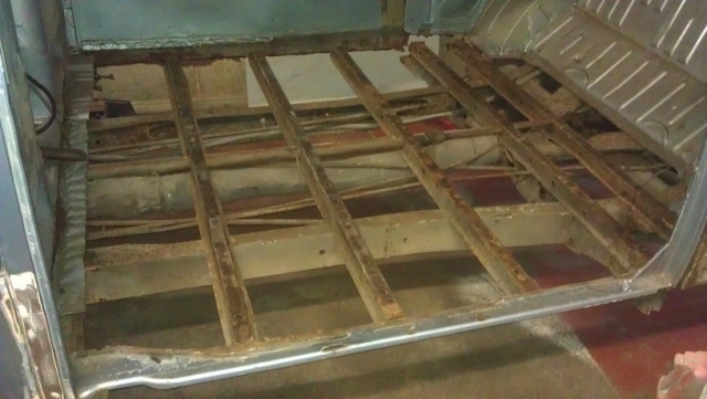 The rotten cargo floor was removed, and the front top hat section and inner B posts were replaced