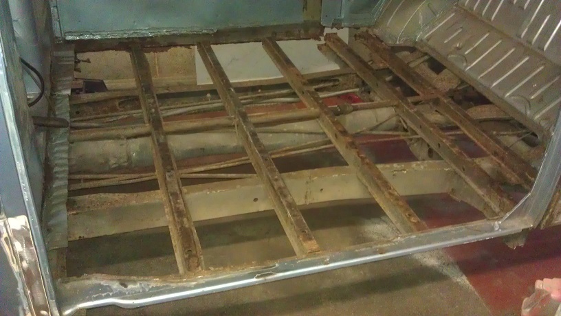 The rotten cargo floor was removed, and the front top hat section and inner B posts were replaced